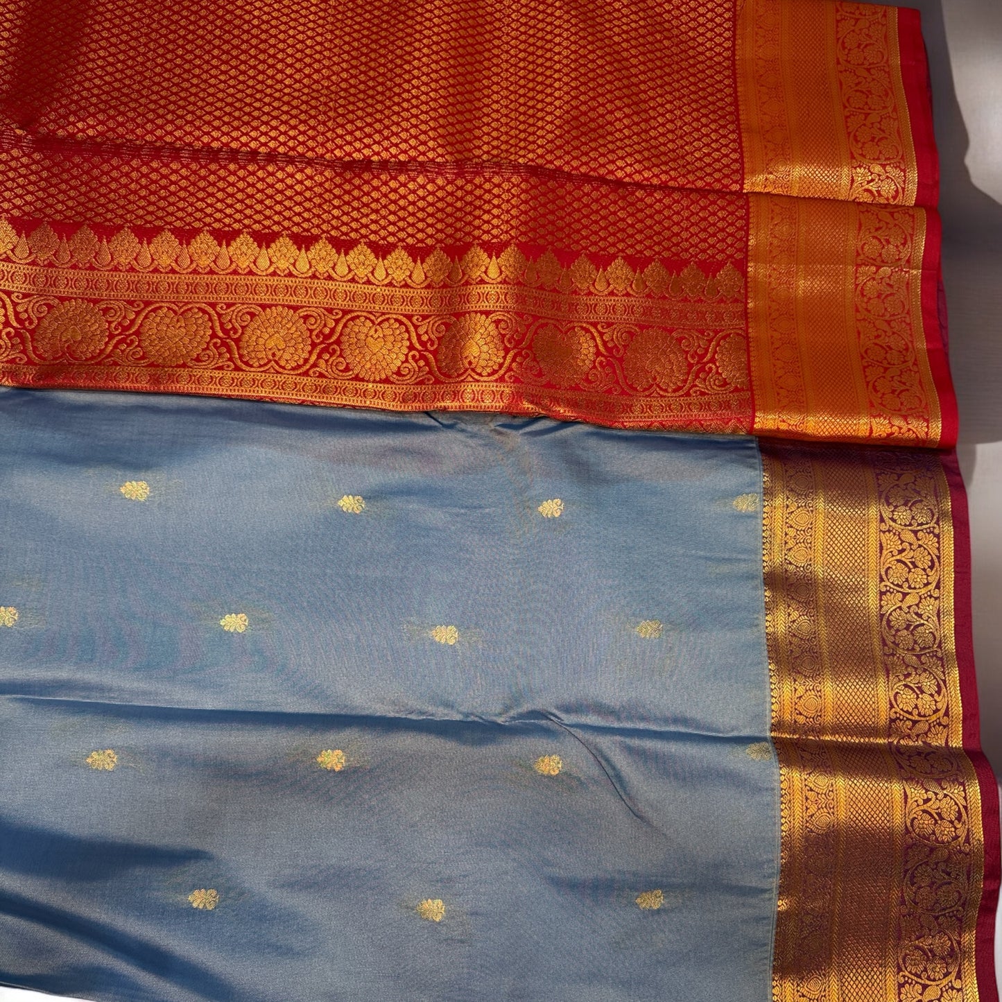 SEMI SILK SAREE – SKY BLUE WITH SMALL BUTTA & RED MEDIUM GOLDEN BORDER