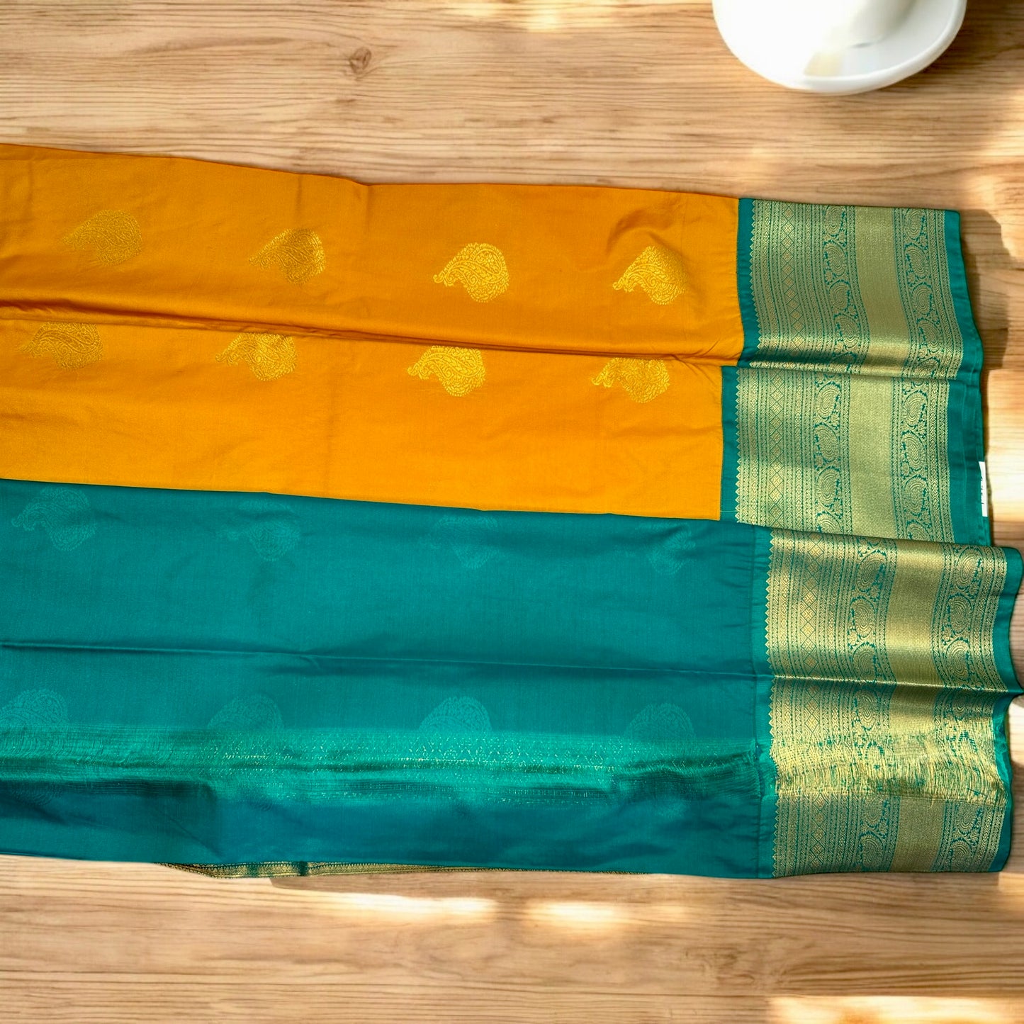 SEMI SILK SAREE – DARK YELLOW WITH SOLID PATTERN AND GREEN BIG GOLDEN BORDER