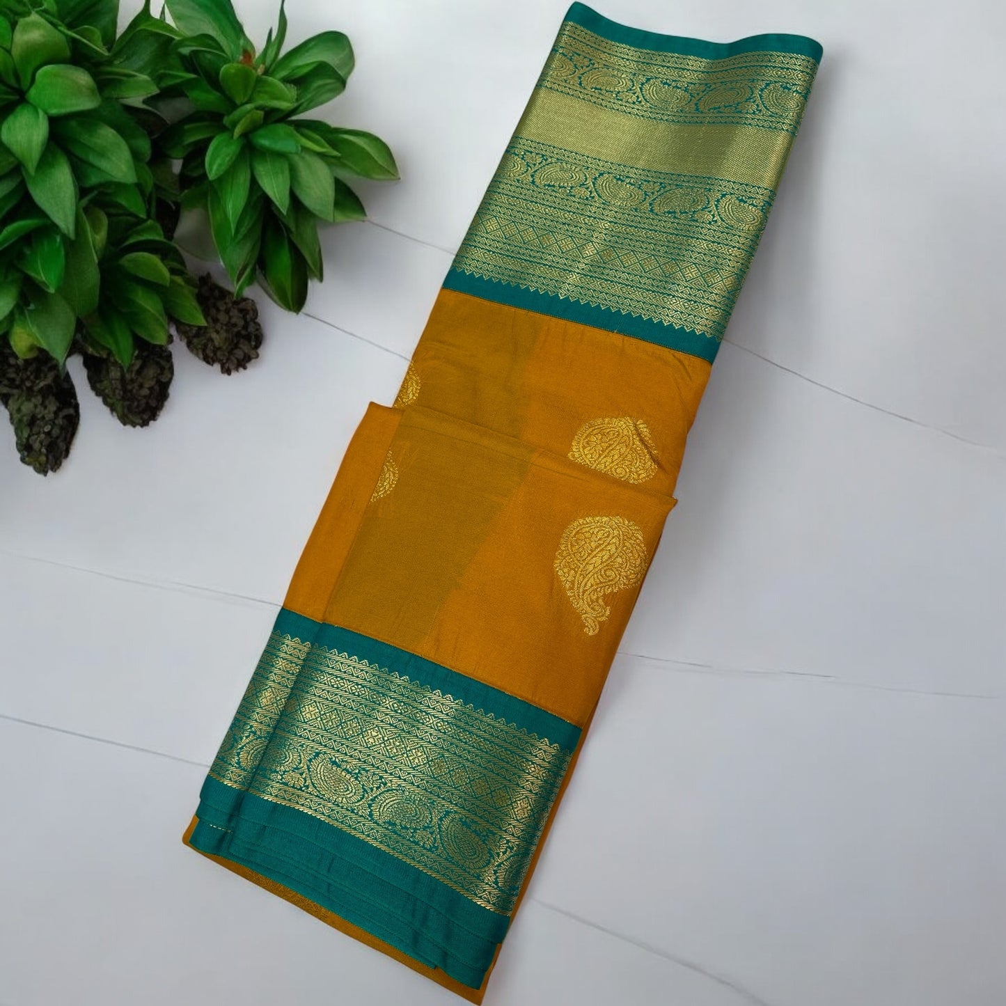 SEMI SILK SAREE – DARK YELLOW WITH SOLID PATTERN AND GREEN BIG GOLDEN BORDER