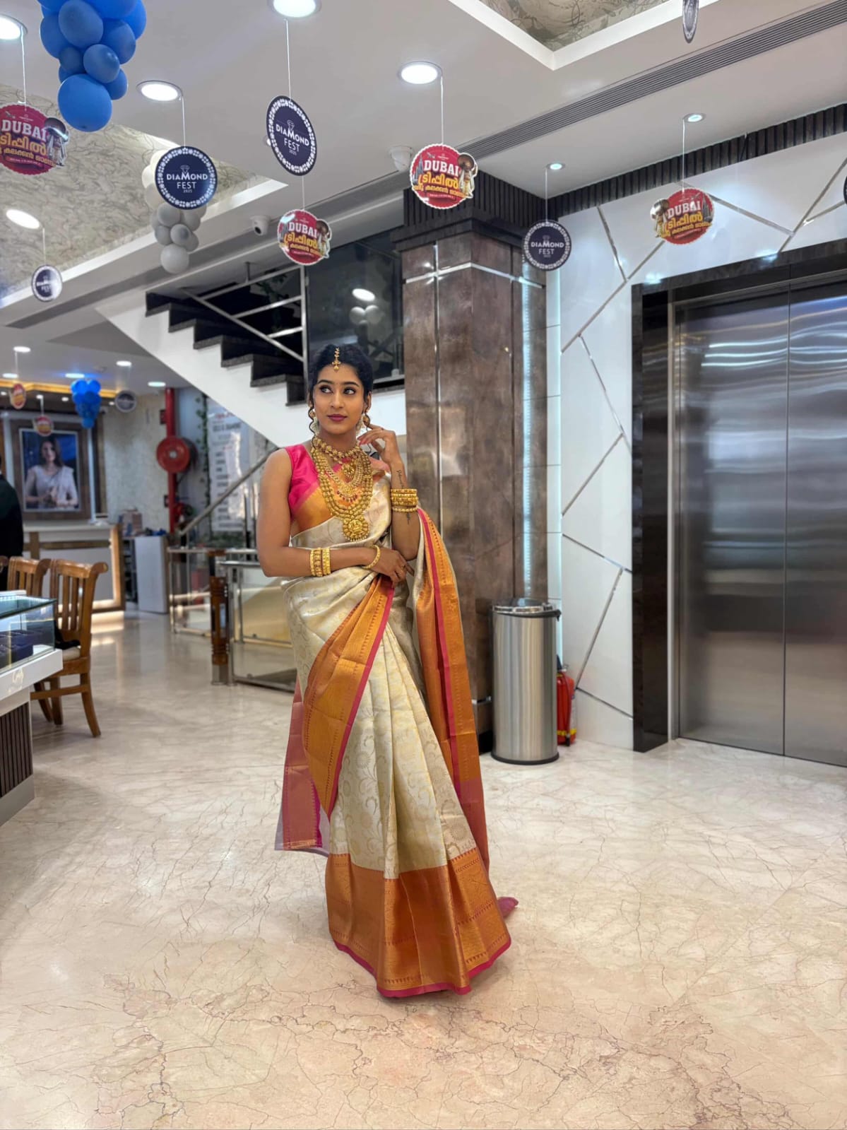 CREAM SOFT SILK SAREE WITH GOLDEN DESIGN AND RICH RED BIG BORDER