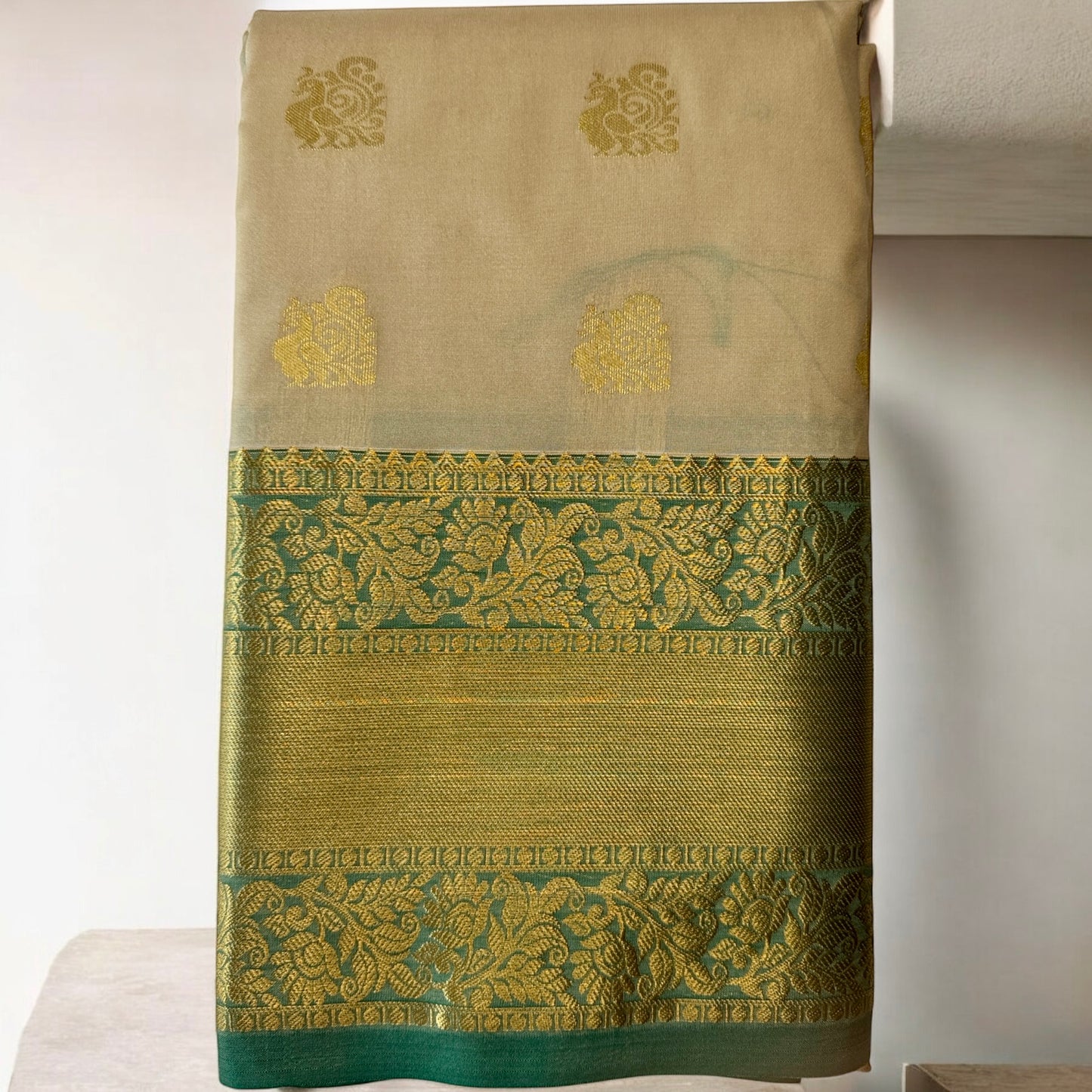 SILK SAREE – OFFWHITE WITH PEACOCK BUTTA AND GREEN-GOLDEN BIG BORDER
