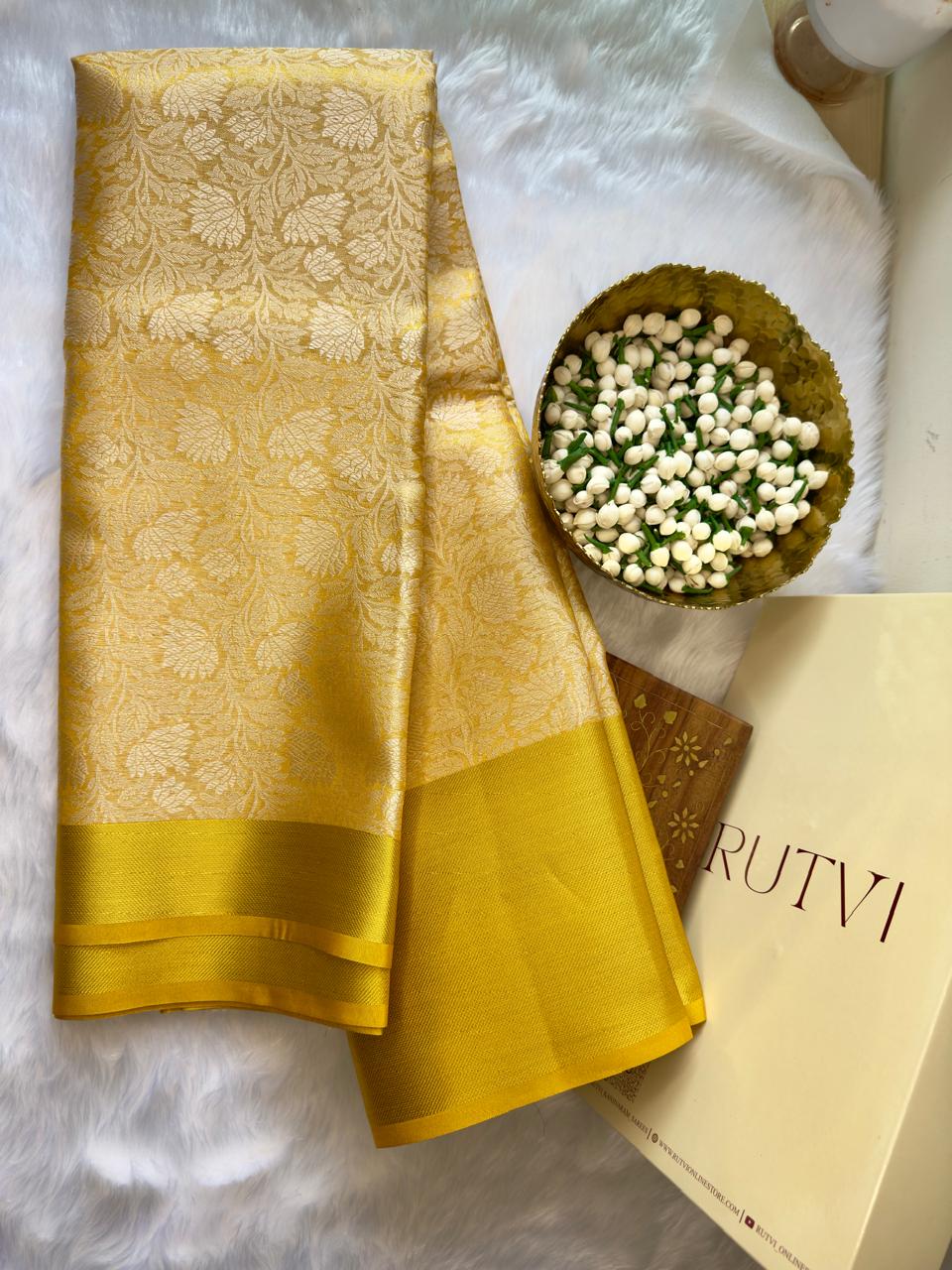 YELLOW SOFT TISSUE SILK SAREE WITH GOLD DESIGN AND ZARI BORDER