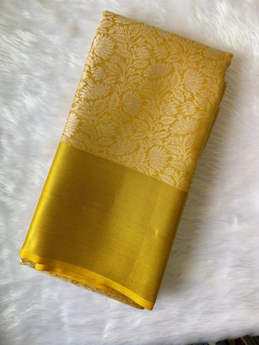 YELLOW SOFT TISSUE SILK SAREE WITH GOLD DESIGN AND ZARI BORDER