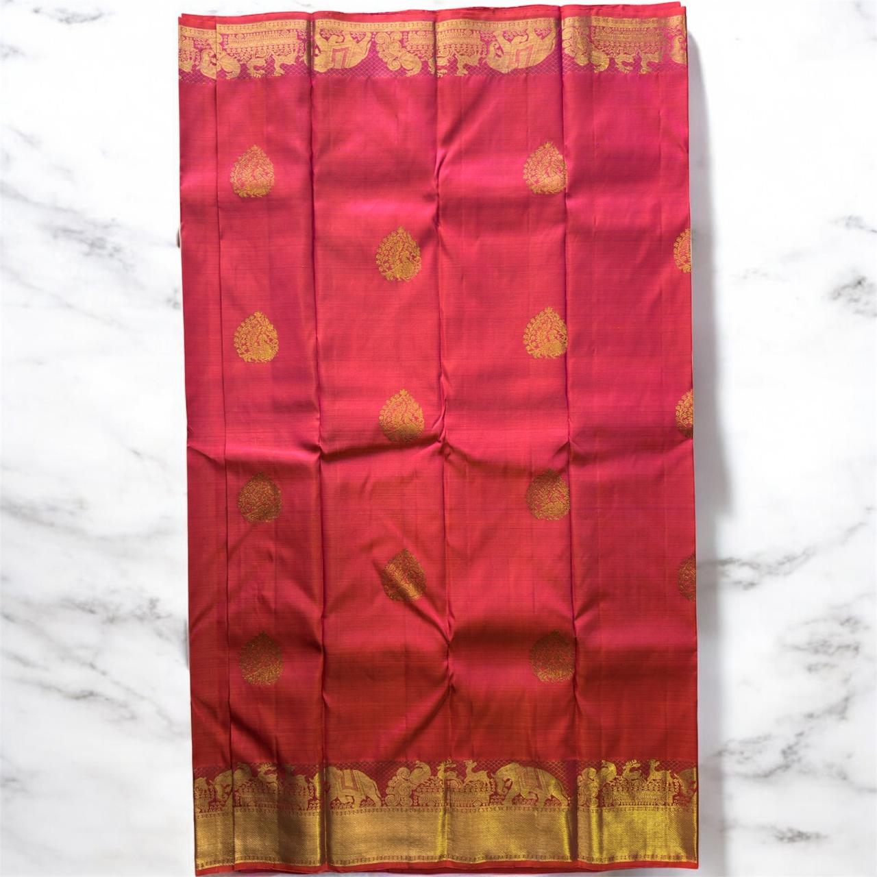 DEEP REDDISH PINK WITH ELEPHANTS, HORSES & TEMPLE ZARI BORDER